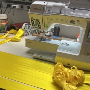 sewing machine with yellow seatbelts